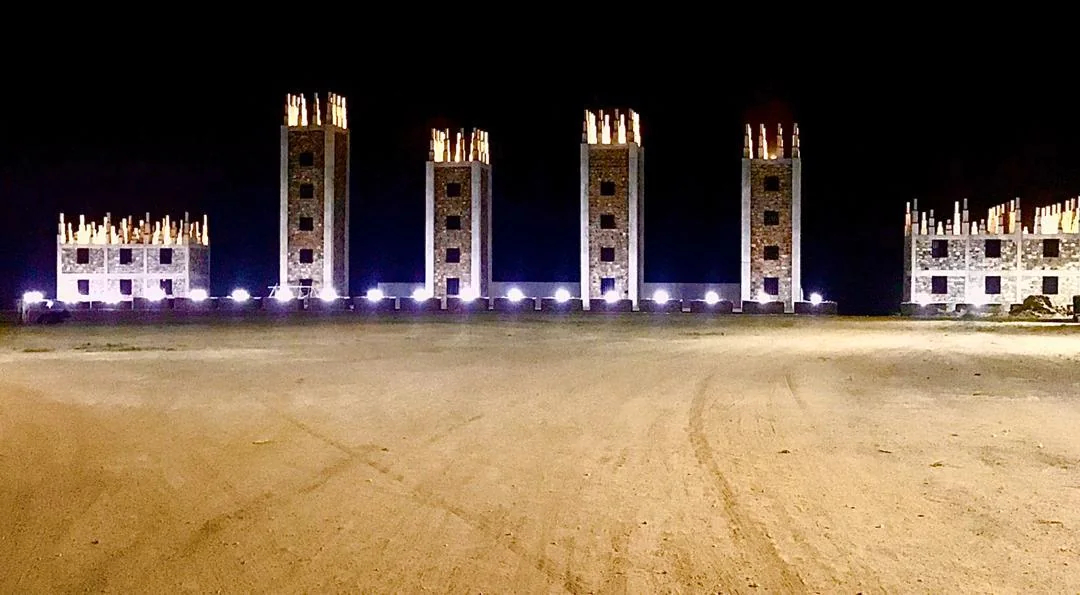 The towers of the Anagkazo campus lit up at night